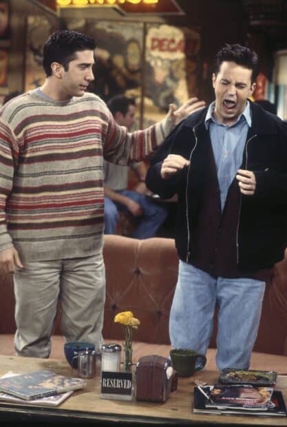Ross comforts a distressed friend in a coffee shop scene, 2K Mobile Wallpaper