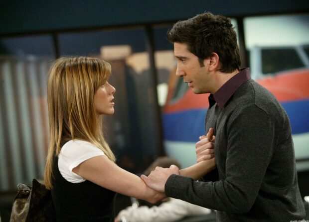 Ross holds Rachel's arms during a serious conversation in the airport, HD Desktop Wallpaper