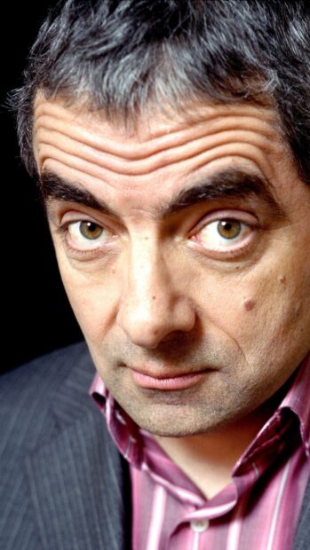 Rowan Atkinson shows a thoughtful expression in this close up portrait, HD Mobile Wallpaper