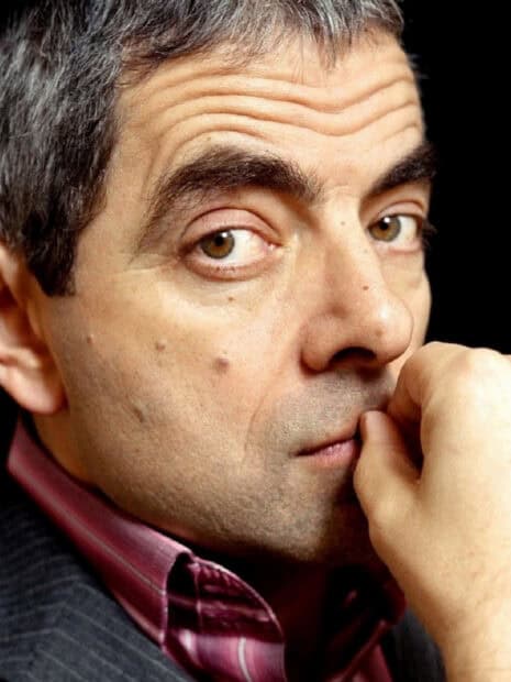 Rowan Atkinson looks thoughtfully into the camera with his hand near his mouth, HD Phone Wallpaper