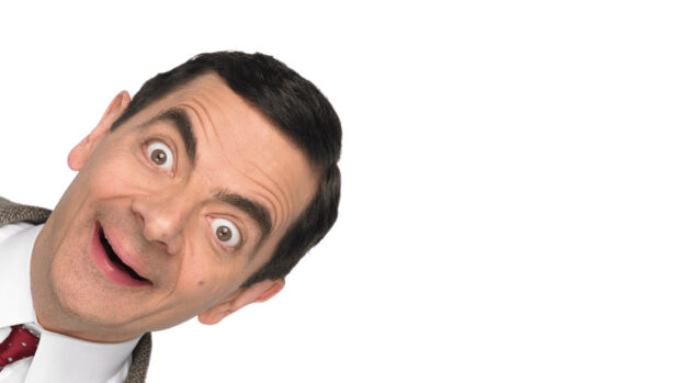 Rowan Atkinson displays a humorous surprised face leaning to the side, HD Desktop Wallpaper