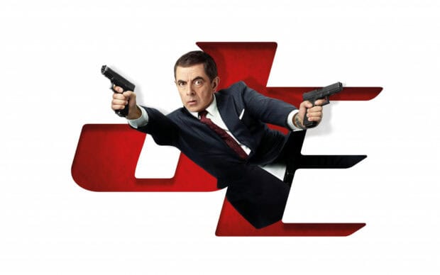 Rowan Atkinson is shown holding two guns in a dramatic action pose against a white background with red letters, HD Desktop Wallpaper