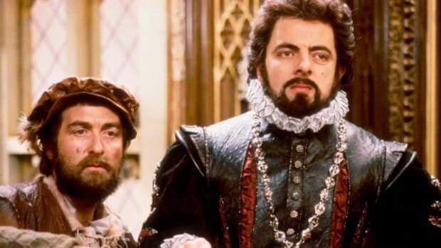 Rowan Atkinson in a detailed period costume with a ruffled collar, HD Desktop Wallpaper