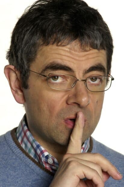 Rowan Atkinson making a shushing gesture with his finger on lips, 2K Phone Wallpaper