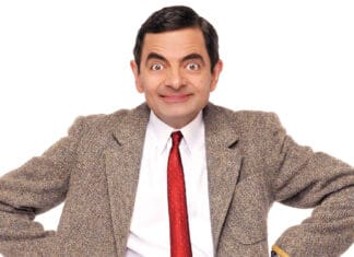 Rowan Atkinson wallpapers shows a man in a brown tweed jacket and red tie smiling, HD Desktop Wallpaper
