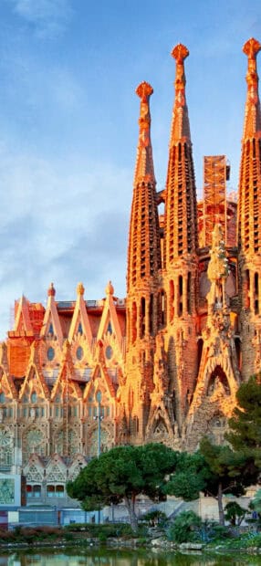 The Sagrada Familia shows intricate towers and detailed facade in warm light, HD Mobile Wallpaper