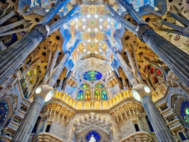 The Sagrada Familia showcases stunning colorful stained glass and detailed stone columns inside, HD Desktop Wallpaper