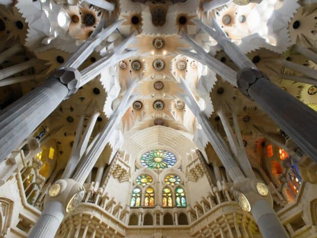 The Sagrada Familia showcases detailed stained glass windows and pillars inside the church, HD Desktop Wallpaper