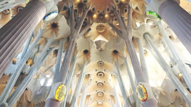 The Sagrada Familia interior features unique pillars and artistic ceiling details, 4K Desktop Wallpaper