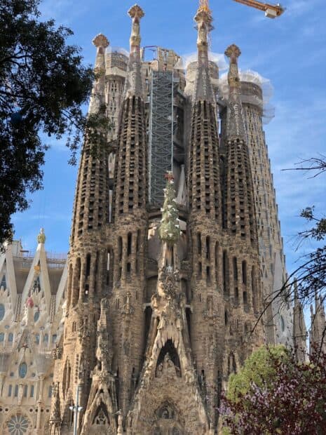 The iconic Sagrada Familia towers showcase intricate architecture and religious sculptures, HD Mobile Wallpaper
