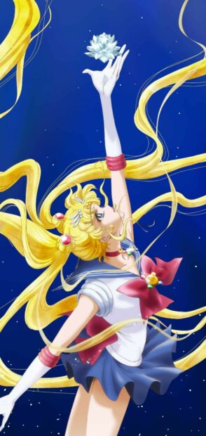 Sailor Moon Eternal character stretches her arm holding a crystal against a starry night sky, 2K Phone Wallpaper
