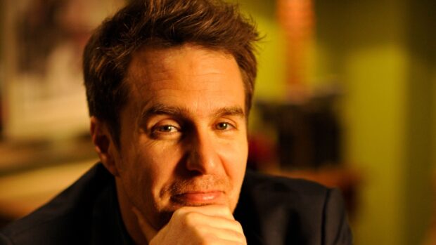 Sam Rockwell gazes thoughtfully with warm lighting, 2K Desktop Wallpaper