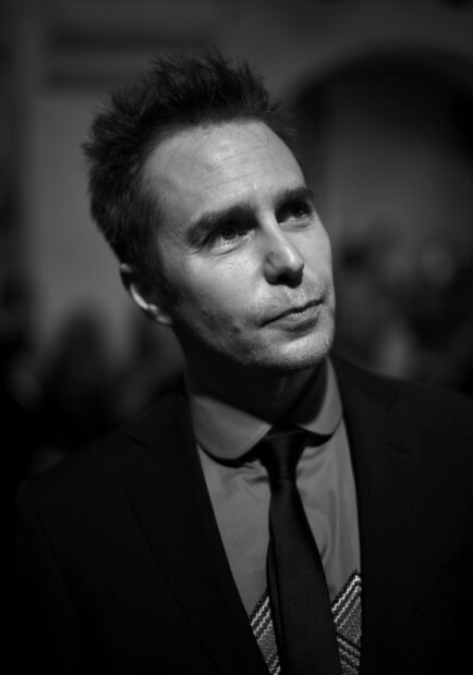 Sam Rockwell wears a suit with a contemplative expression in a black and white setting, HD Desktop Wallpaper