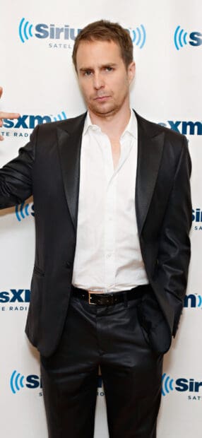 Sam Rockwell is posing confidently in a black suit and white shirt at an event, HD Phone Wallpaper
