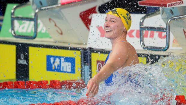 Sarah Sjostrom smiles happily in the swimming pool after a race, HD Desktop Wallpaper