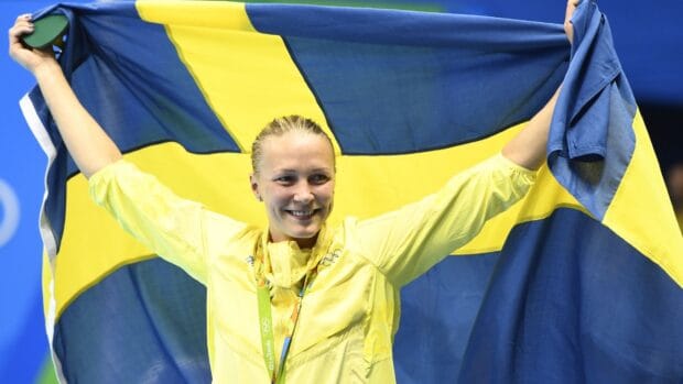 Sarah Sjostrom celebrates her victory holding the Swedish flag, HD Desktop Wallpaper