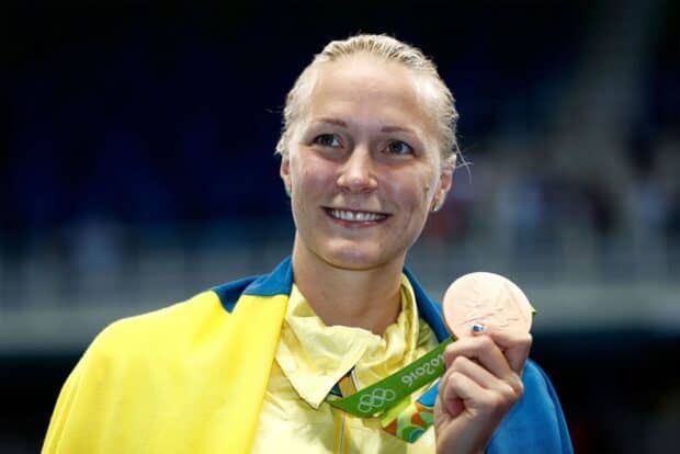 Sarah Sjostrom proudly holding a bronze medal at the 2016 Olympics, HD Desktop Wallpaper