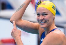 Sarah Sjostrom wallpapers showing a close up of her smile and swim cap in a swimming pool, HD Desktop Wallpaper