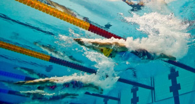 Sarah Sjostrom swims powerfully underwater during a race, 2K Desktop Wallpaper