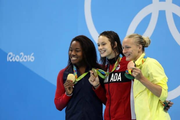 Sarah Sjostrom celebrates with fellow swimmers at Rio 2016 Olympics holding medals, HD Desktop Wallpaper