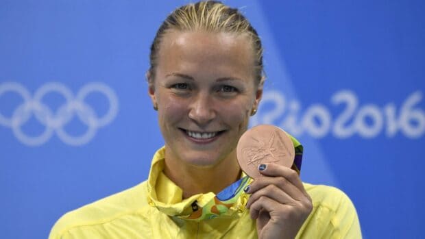 Sarah Sjostrom is smiling and holding her Olympic medal at the Rio 2016 event, HD Desktop Wallpaper