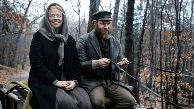 Sarah Snook Wallpapers showing a woman smiling beside a bearded man in a wooded area, 4K Desktop Wallpaper