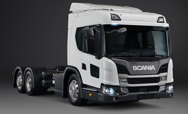 A white Scania L320 truck is shown from the front side on a dark background, HD Desktop Wallpaper