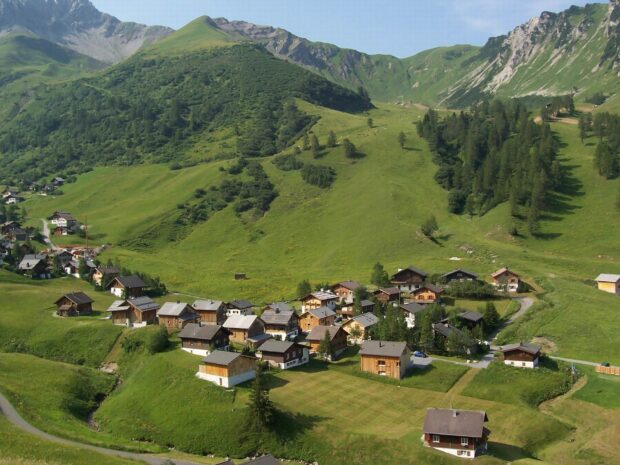 A picturesque village nestled in green hills and forests in Liechtenstein wallpapers, HD Desktop Wallpaper