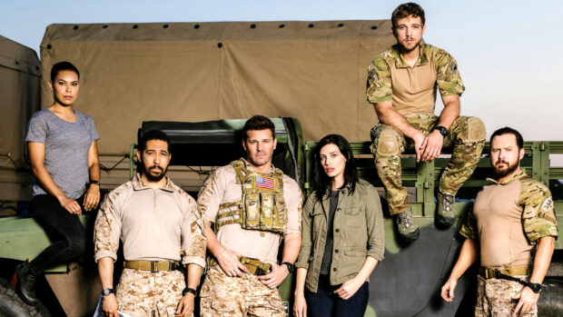 The Seal Team cast is standing and sitting near a military vehicle at sunset, HD Desktop Wallpaper