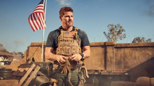 A Seal Team Tv Series wallpapers soldier stands ready with an American flag behind him, HD Desktop Wallpaper
