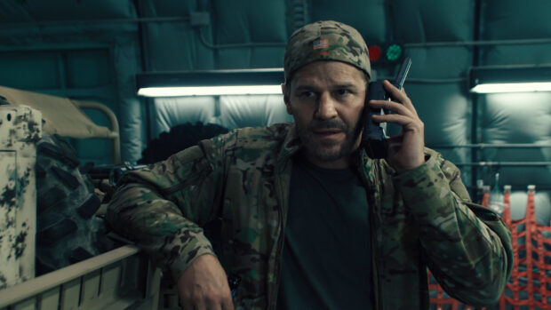 A Seal Team Tv Series Wallpapers character talks on a radio inside a military vehicle, HD Desktop Wallpaper