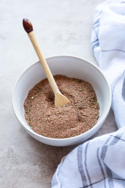 A bowl filled with seasoning mix and a wooden spoon inside on a table, HD Mobile Wallpaper