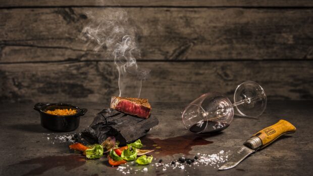 A grilled steak with seasoning and wine glass spilled on the table, 4K Desktop Wallpaper
