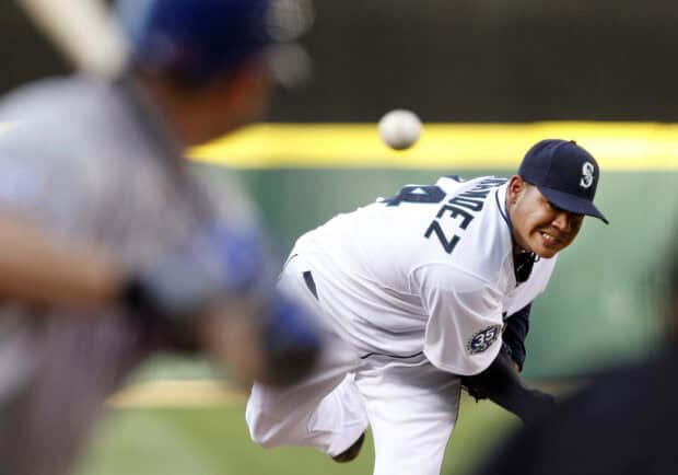 A Seattle Mariners pitcher throwing a baseball during a game, HD Desktop Wallpaper