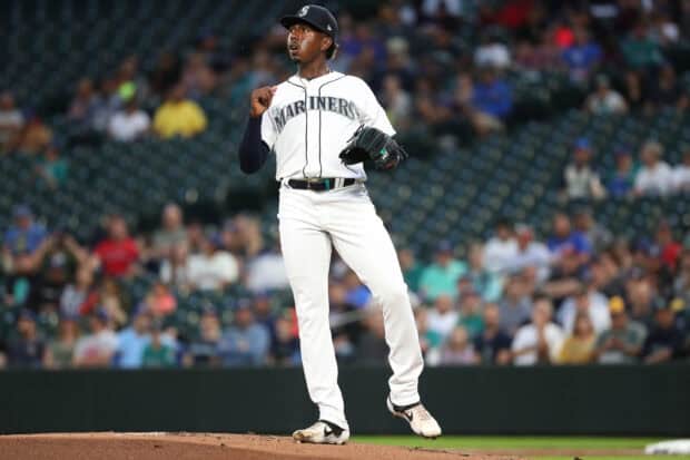 A Seattle Mariners player is pitching during the game in front of the crowd, 2K Desktop Wallpaper