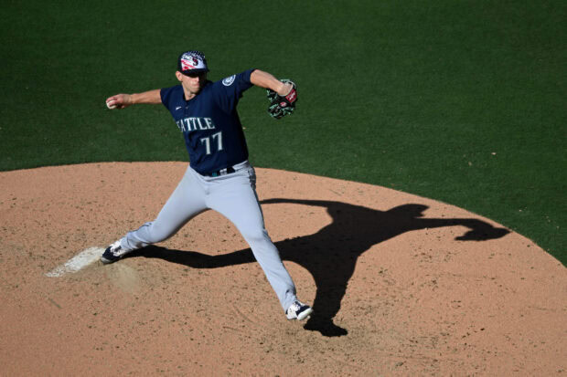 A Seattle Mariners pitcher is captured mid throw on the mound during a baseball game, 2K Desktop Wallpaper