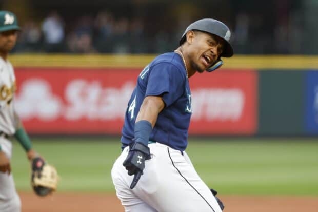 A Seattle Mariners player is reacting passionately during a game, HD Desktop Wallpaper