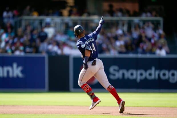 A Seattle Mariners player wearing number 44 celebrates while running on the baseball field, 2K Desktop Wallpaper