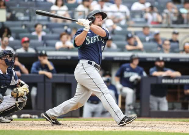A Seattle Mariners player swings the bat during a professional baseball game, 2K Desktop Wallpaper