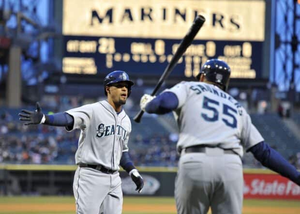 Two Seattle Mariners players celebrate a successful play during a game, 2K Desktop Wallpaper