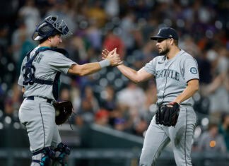 Two Seattle Mariners players celebrate after a successful play during the game, 2K Desktop Wallpaper