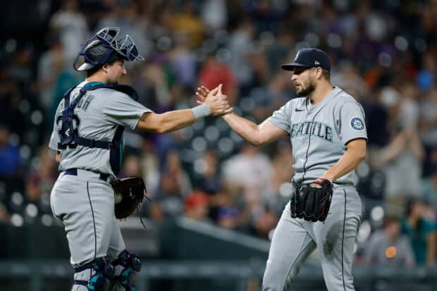 Two Seattle Mariners players celebrate after a successful play during the game, 2K Desktop Wallpaper