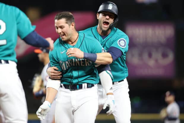 Two Seattle Mariners players celebrating a successful play during the game, 2K Desktop Wallpaper