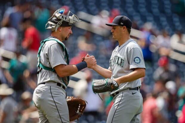 Two Seattle Mariners players shake hands on the field after a game, HD Desktop Wallpaper