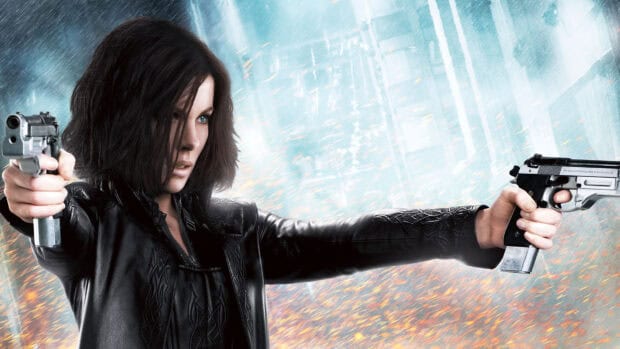 Selene dual wielding guns in an intense action scene from Underworld, HD Desktop Wallpaper