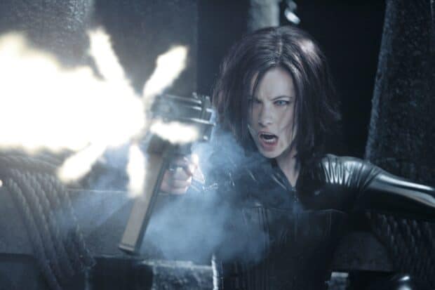 Selene firing a gun fiercely in an intense scene from Underworld, HD Desktop Wallpaper