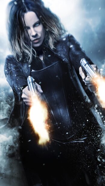 Selene is shown firing dual pistols in an intense battle scene from Underworld, HD Phone Wallpaper