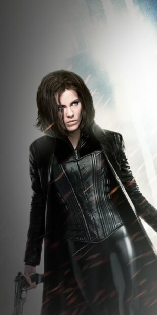 Selene from Underworld is holding a gun and looking intensely forward, HD Mobile Wallpaper