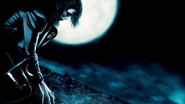Selene from Underworld crouches over a cityscape under a glowing full moon, 4K Desktop Wallpaper