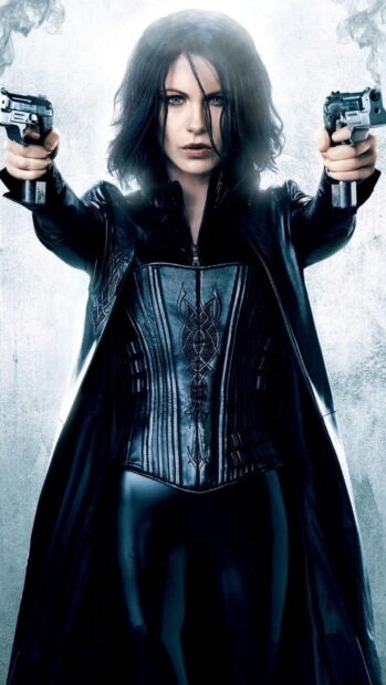 Selene holds two guns pointing forward with a determined look in this Selene Underworld Wallpapers, HD Mobile Wallpaper